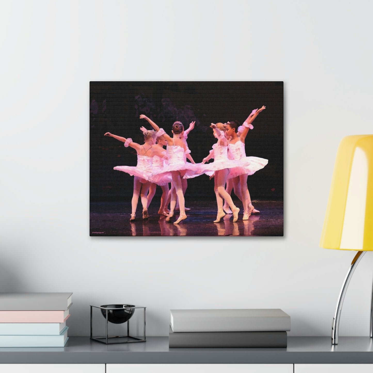 Group of child ballerinas dressed in pink tutus.