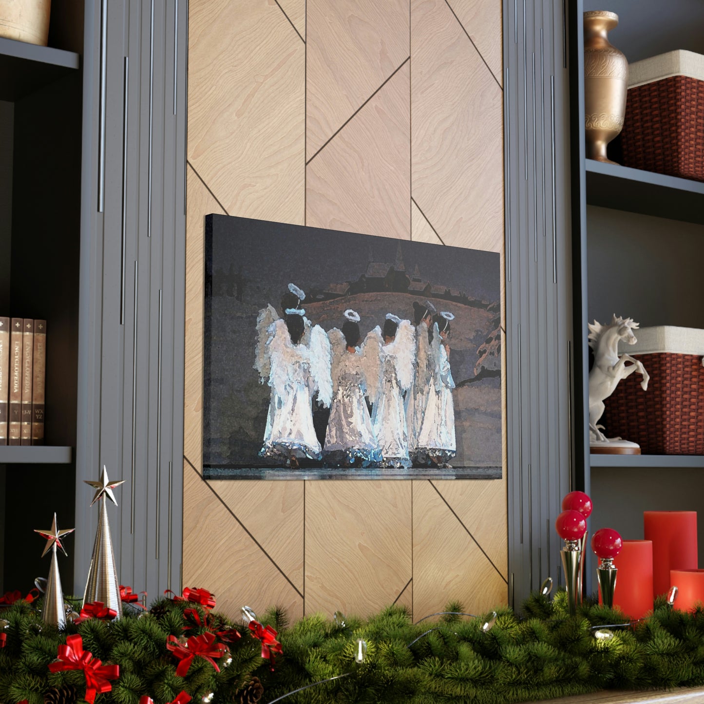 Canvas print of a watercolor style painting hanging on a wall of children in angel costumes with a winter scene backdrop