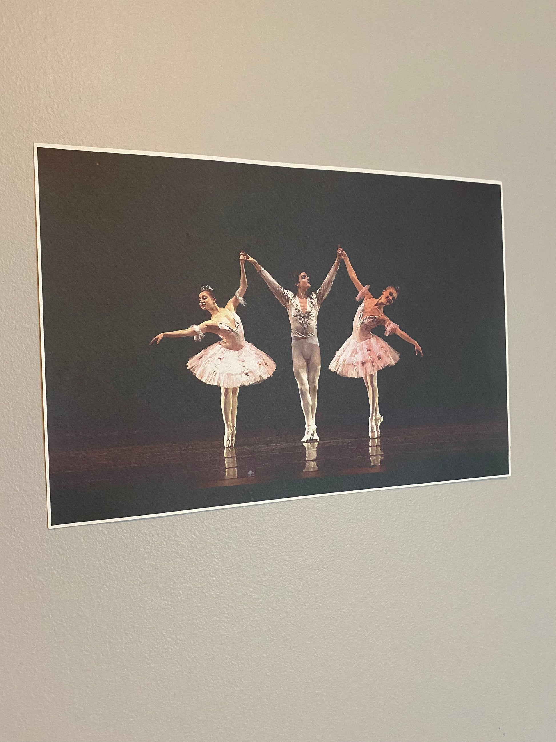 Ballet dancers performing on dark stage