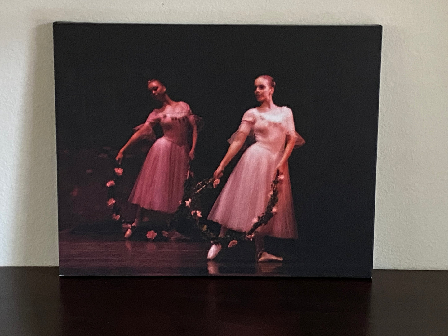 painting of two ballerinas performing in pink on stage with pink rose wreaths