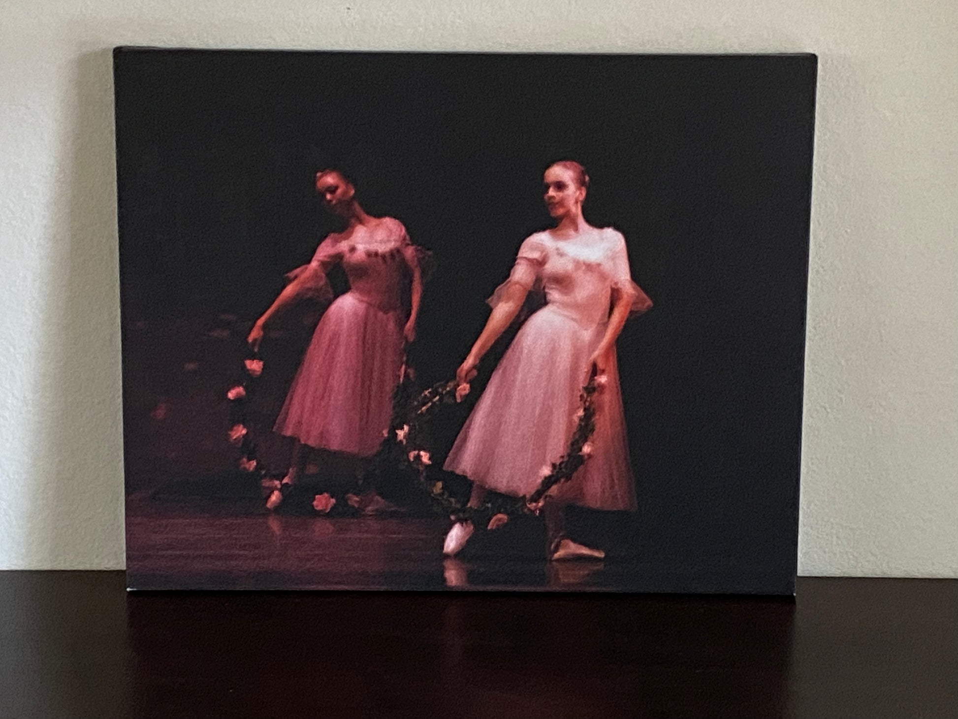 painting of two ballerinas performing in pink on stage with pink rose wreaths