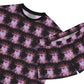 Close up view of Shortie pajamas laid flat with black ribbed neck. Print is ballerinas in blue on a black background.