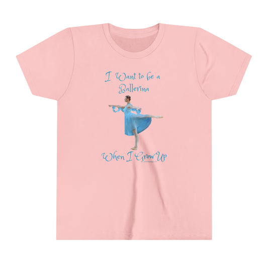 front of Pink t-shirt with a ballerina in blue and I want to be a ballerina pictured and when I grow up written in blue