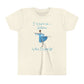 Front view of a cream colored t-shirt with a ballerina wearing light blue costume pictured and I want to be a ballerina when I grow up written in teal blue