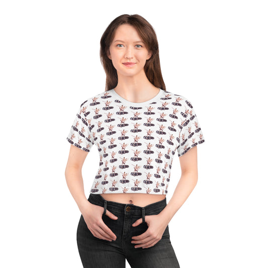 girl wearing a crop top made with a ballet theme print on a white background