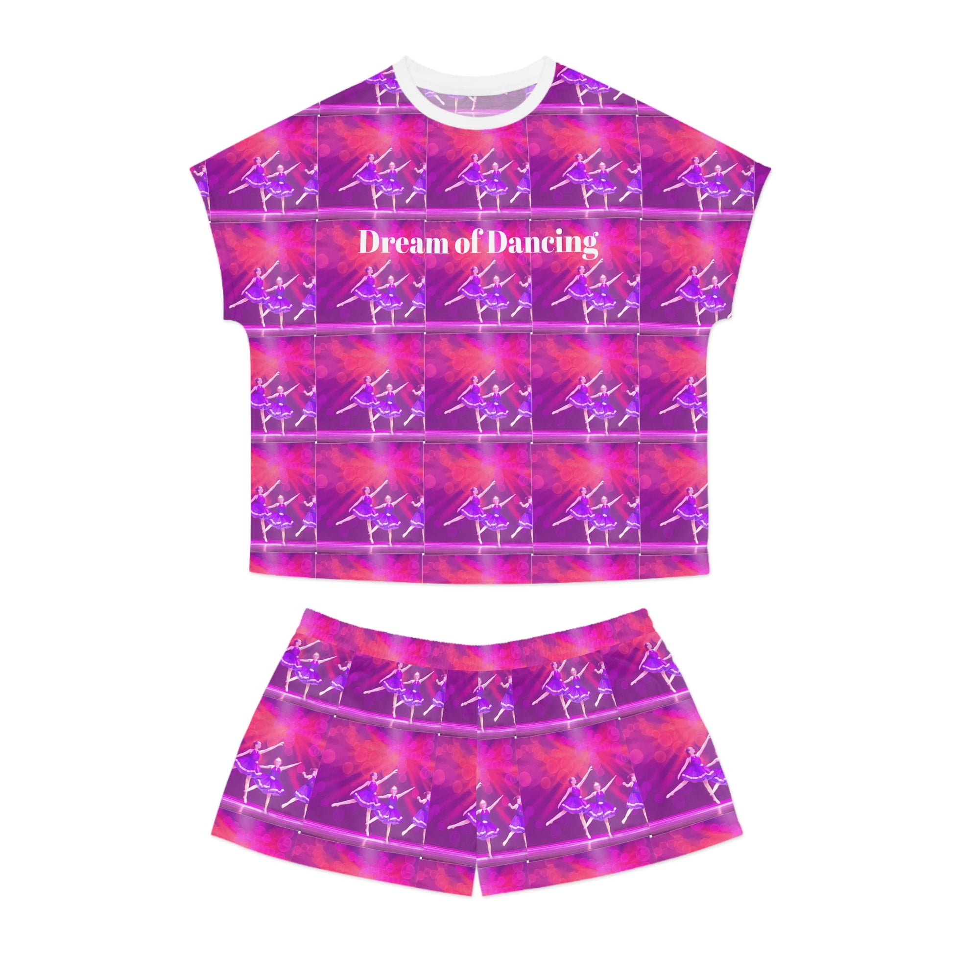 short pajama set laying flat with a white ribbed neck and Dream of Dancing in white letters on a pink and purple ballerina print