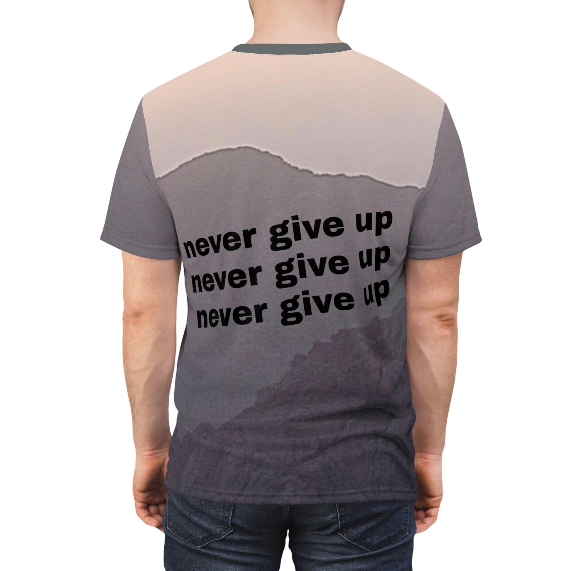 back view of tee shirt in shades of gray that says never give up three times in a row in black letters