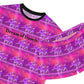 close up view of short pajama set black ribbed neck with black writing on pink and purple ballerina print