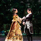 dance performance on stage of 2 dancers dressed in Victorian costumes gold and black