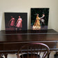 performance painting on display in a home setting on a desk with another dance print