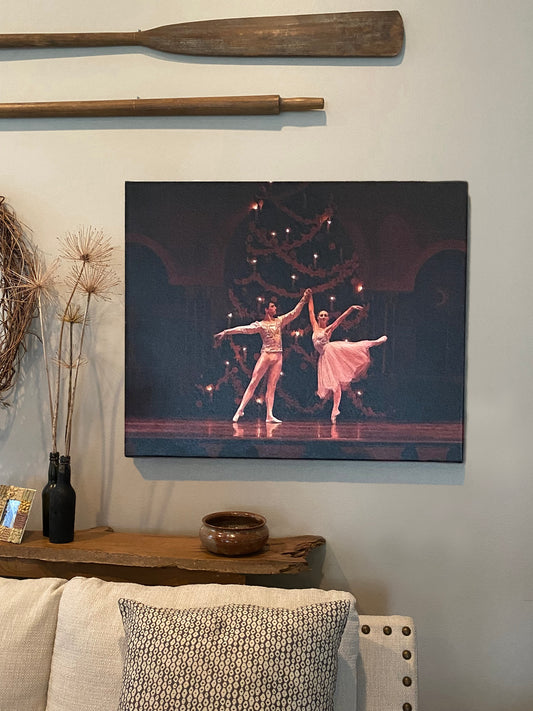 A livingroom setting displaying a painting of digital download # 0338, a Ballet couple dancing in a Nutcracker performance on stage