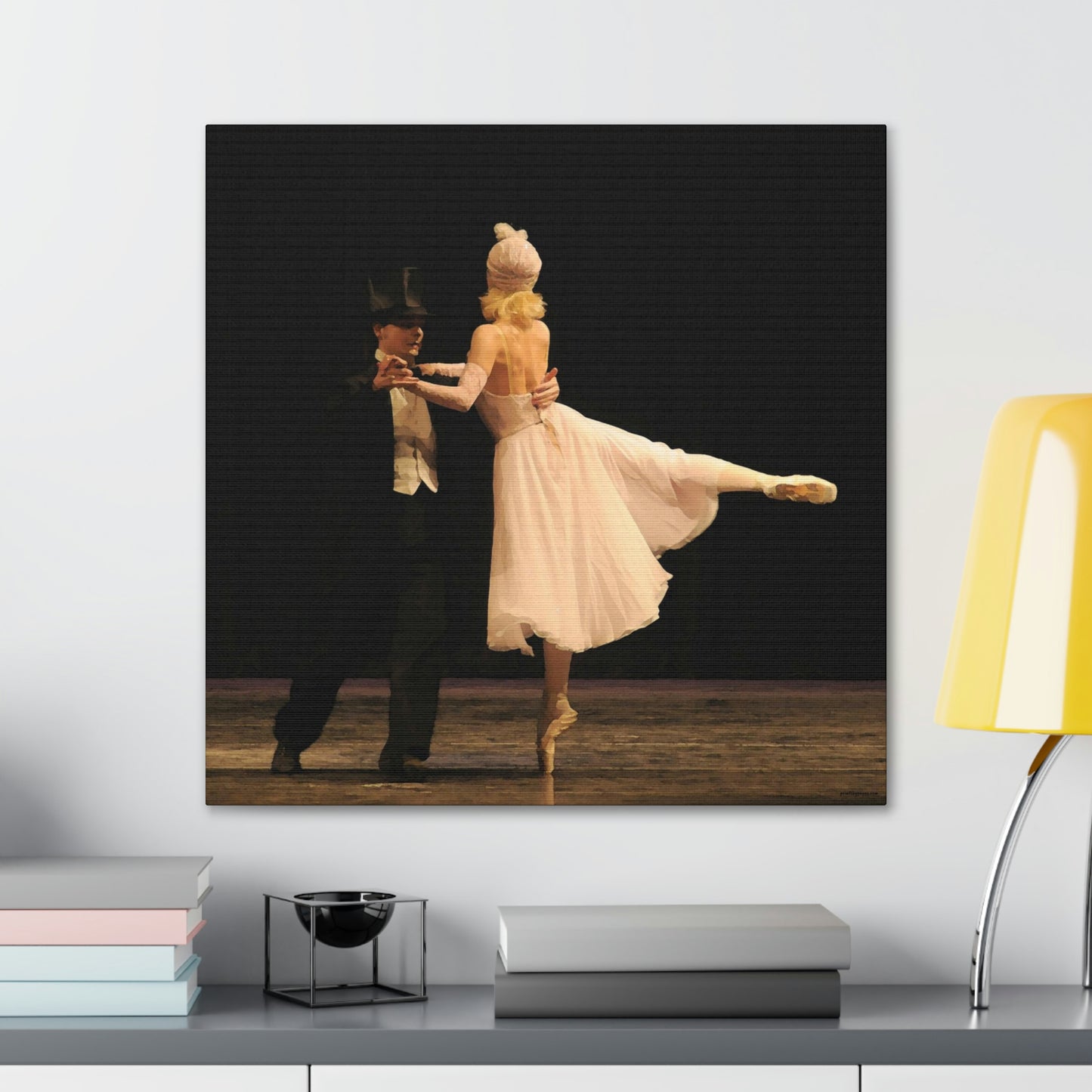 Square Artwork hanging on the wall over a desk of a Ballet dance couple dressed in Tuxedo and Roaring 20's style costumes performing on stage with a dark backdrop.