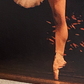 detail of the ballerina's leg in the painting
