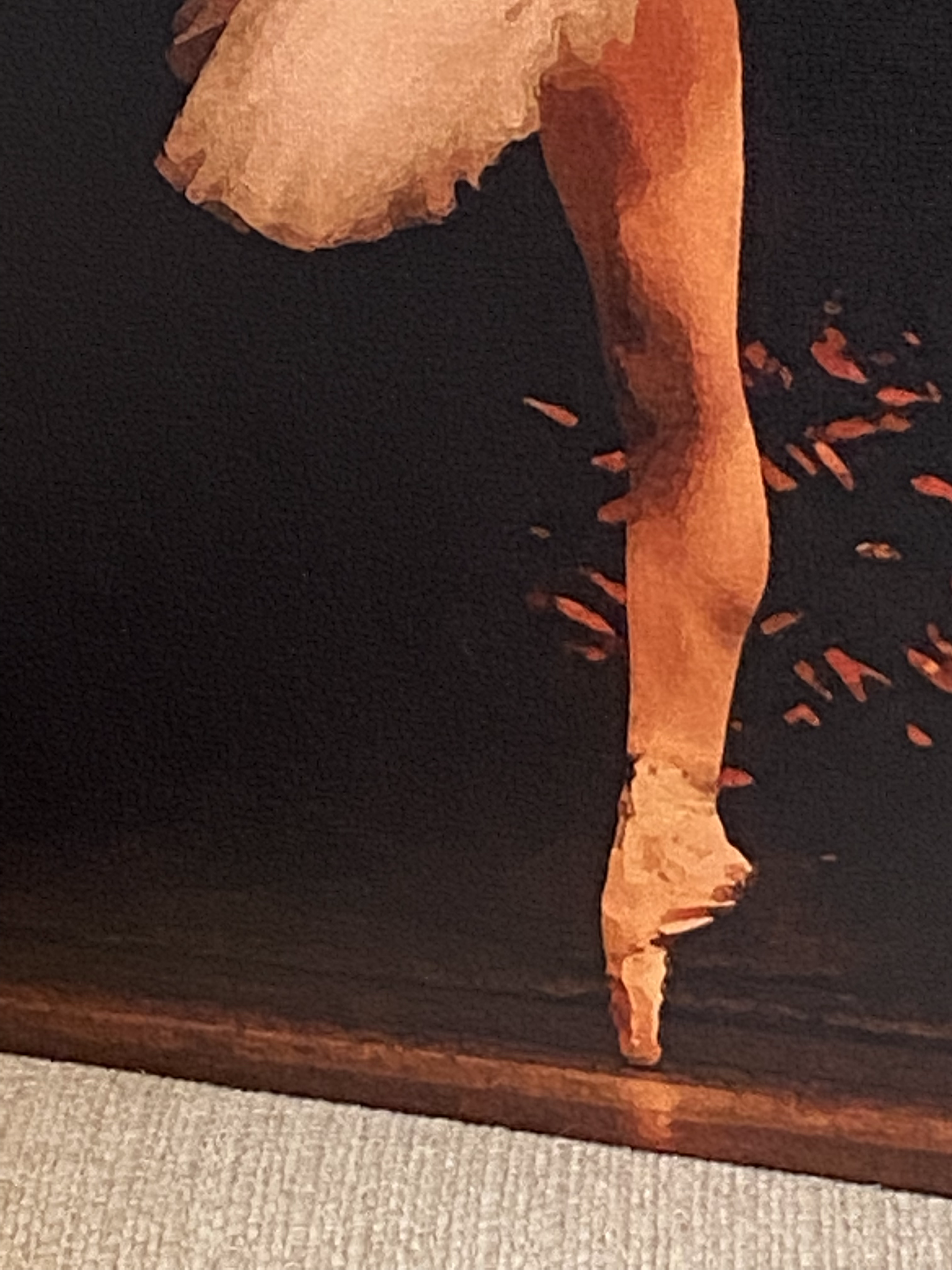 detail of the ballerina's leg in the painting