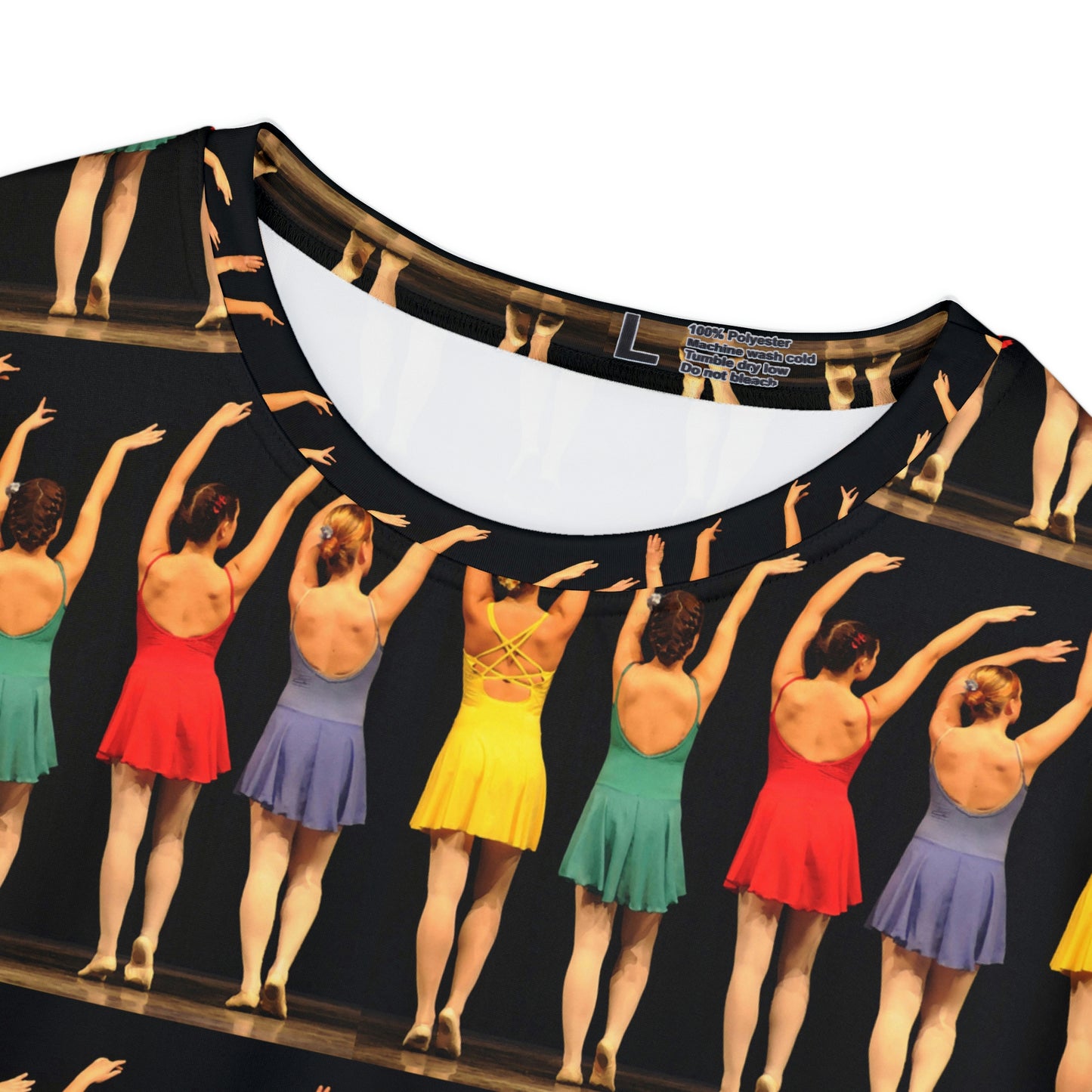 closeup view of the neckband of the shirt with brightly dressed dancers on black background