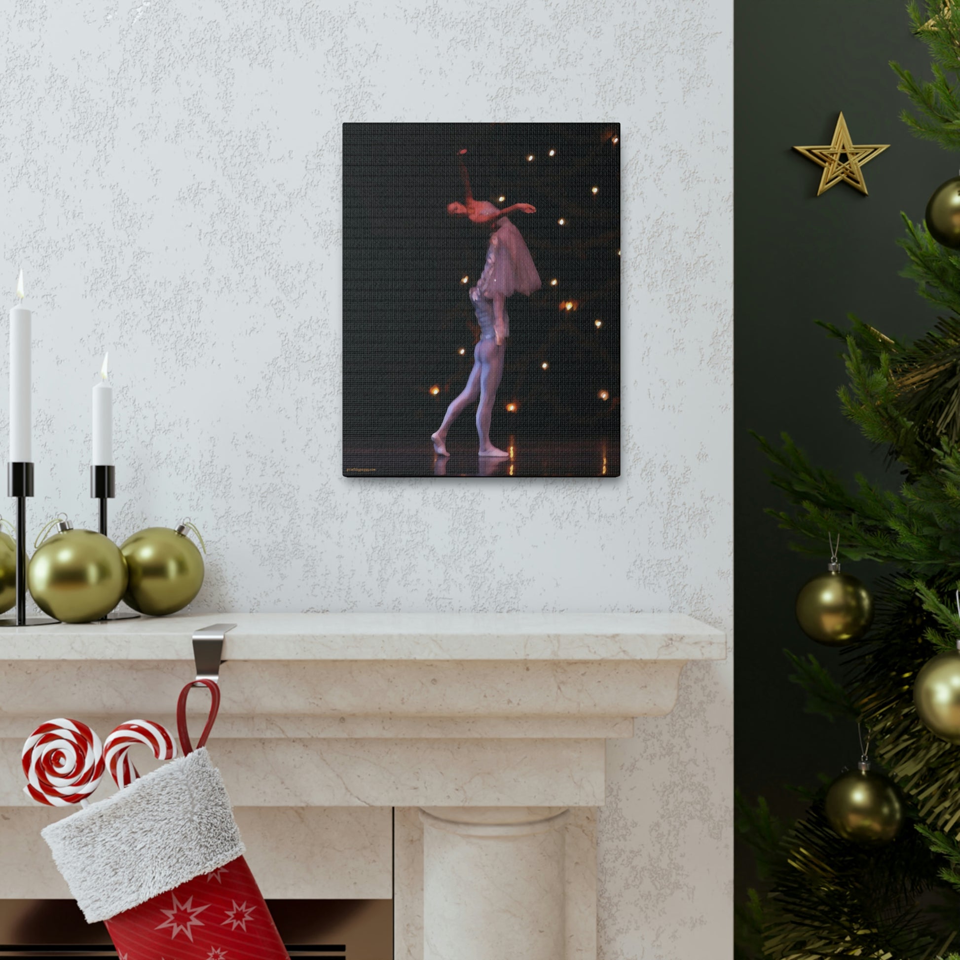 Canvas print of a Nutcracker performance hanging over a fireplace decorated for the holidays with a male dancer lifting a female dancer as they are exiting the stage