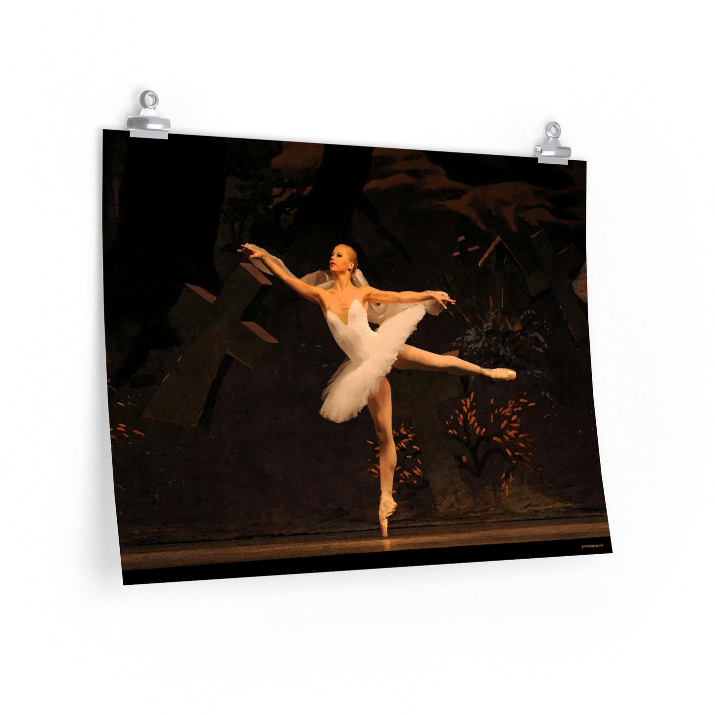 a 16x20 poster of a ballerina in white performing on a dark stage