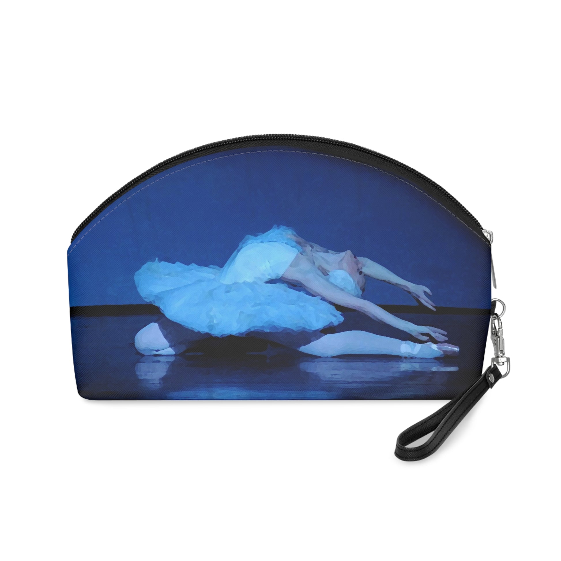 Prima ballerina performing the dying swan dressed in a white tutu bathed in blue light on a black background on a makeup bag.  