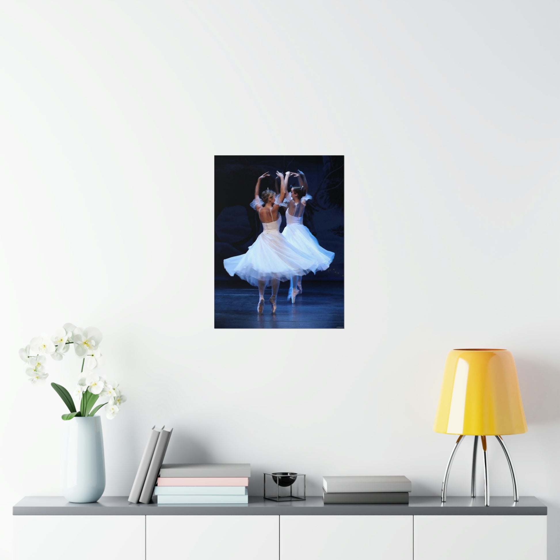 two ballerinas in white flowing costumes with a dark background on a premium matte poster.