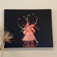 Painting of ballerinas on a dark stage dressed in pink