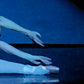 detail closeup head, hands and feet of ballerina painting performing The Dying Swanwan 