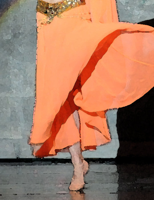 detail view of dancer on stage in orange costume