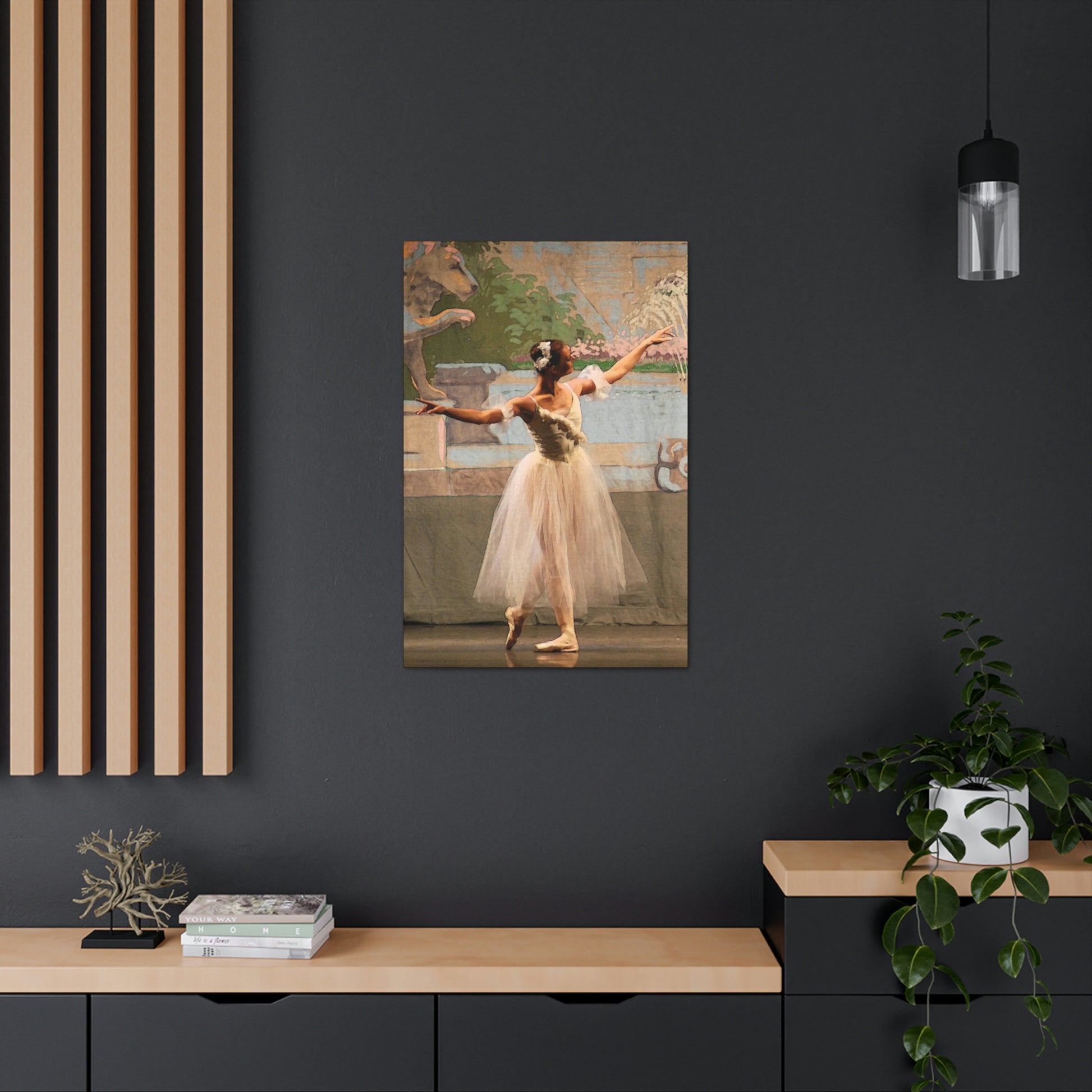 canvas print of a single ballet dancer in white with muted pastel background hanging on a dark wall in a home setting