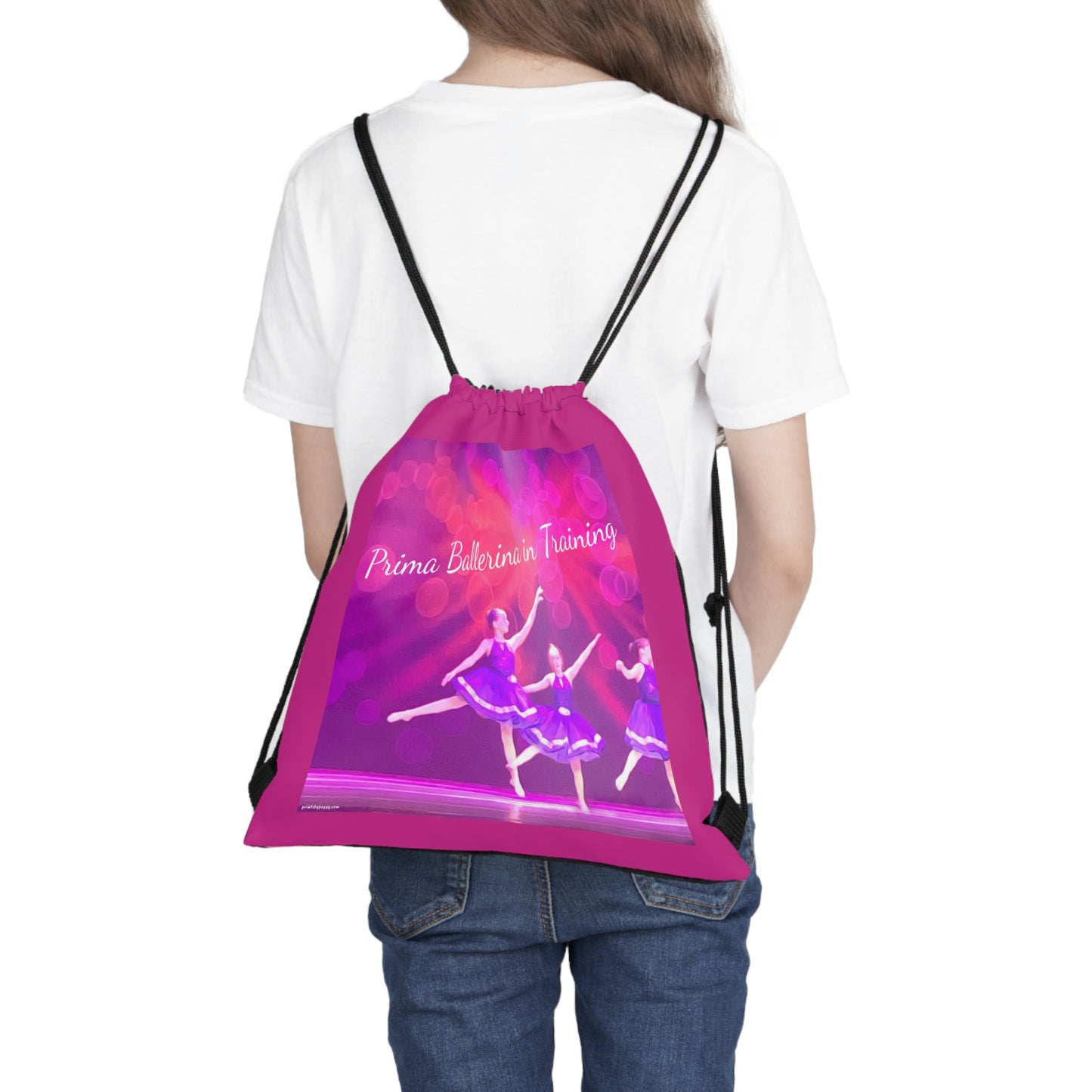 Hot pink drawstring bag text saying Prima Ballerina in Training with youth dancers in purple ballet costumes