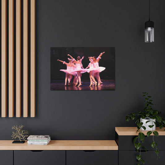 Group of child ballerinas dressed in pink tutus.
