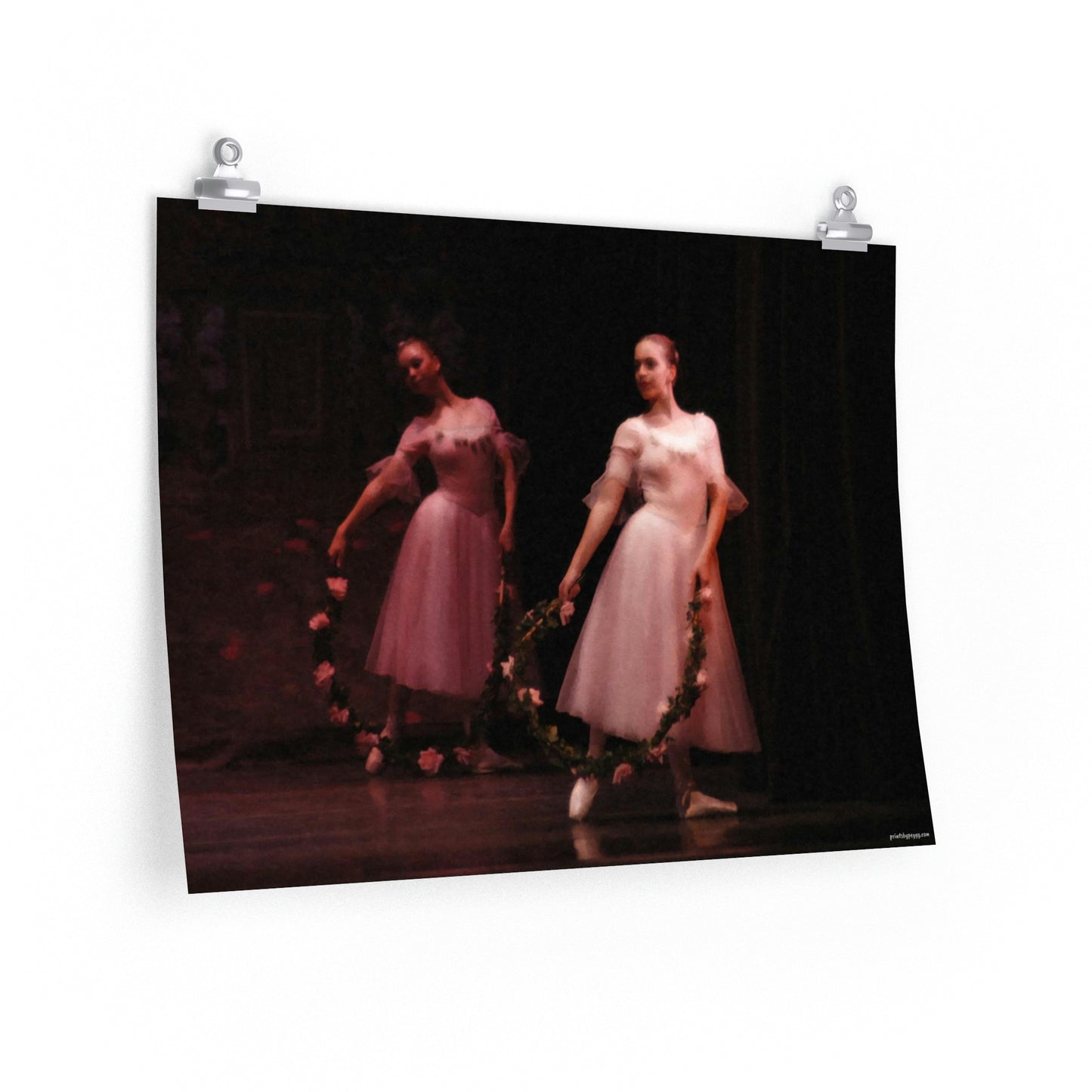 two female dancers in pink holding floral wreaths on a premium matte poster.