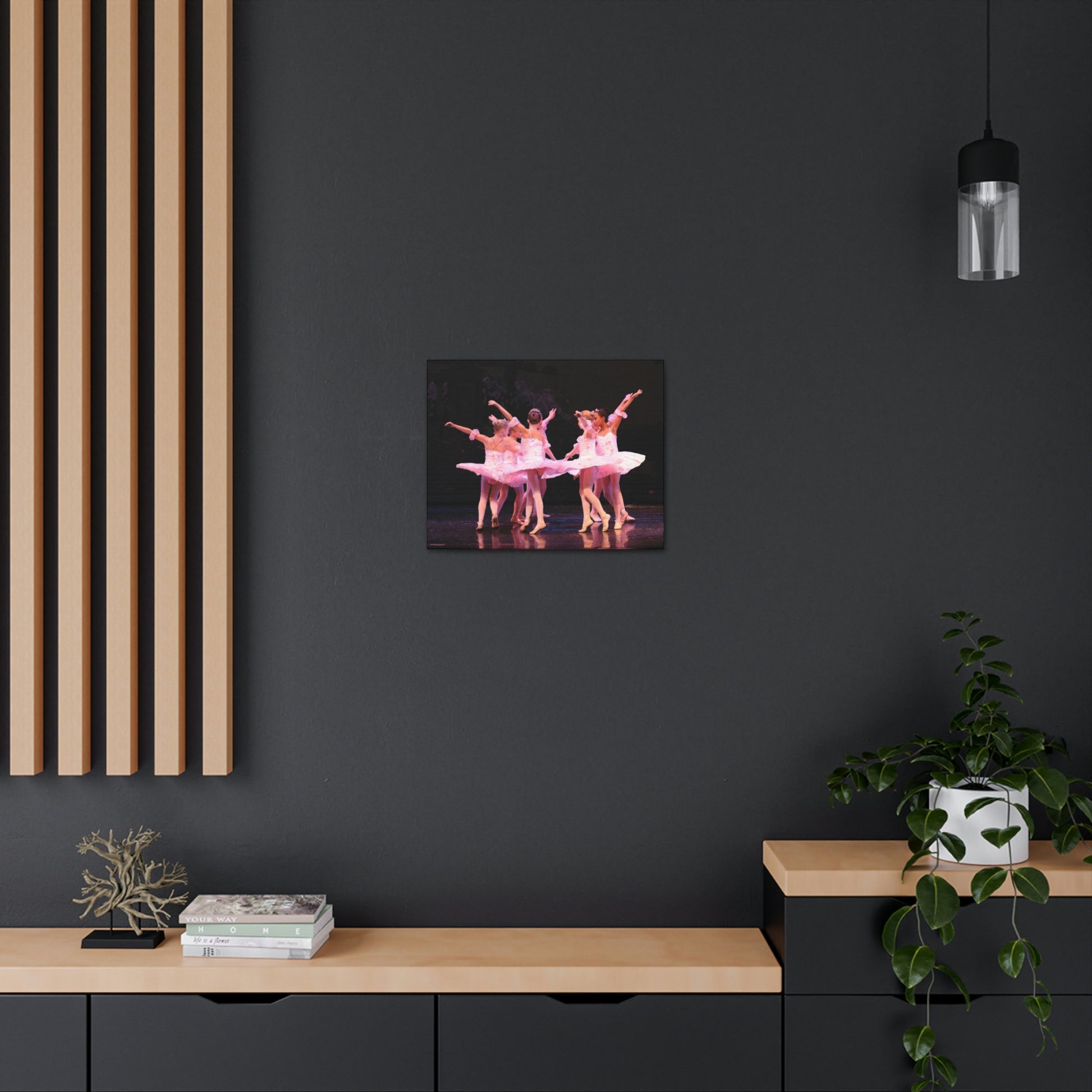 Group of child ballerinas dressed in pink tutus. 