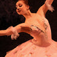 detail section of photo of painting of 3 ballet dancers performing on stage - detail of 1 face and costume