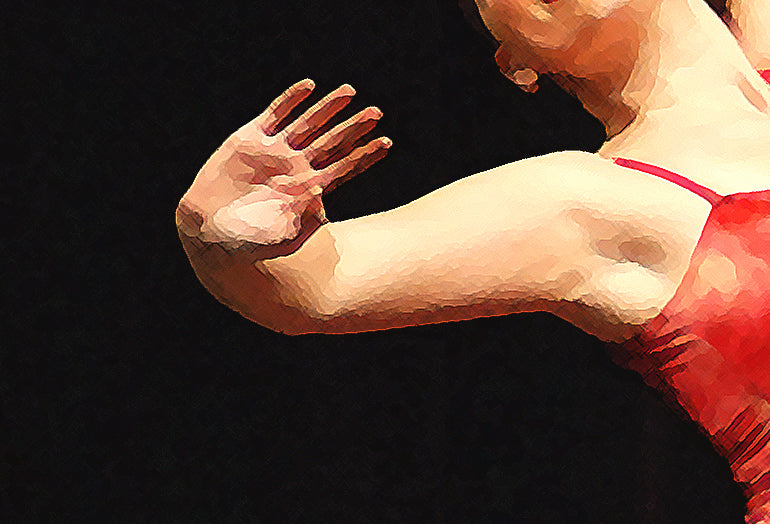 Detail section showing dancer's hand and arm