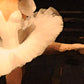 detail section of a ballet dancer's white costume