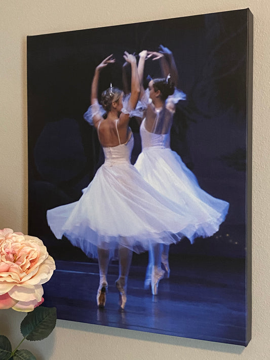 painting of two ballerinas wearing tiaras and white dresses on point