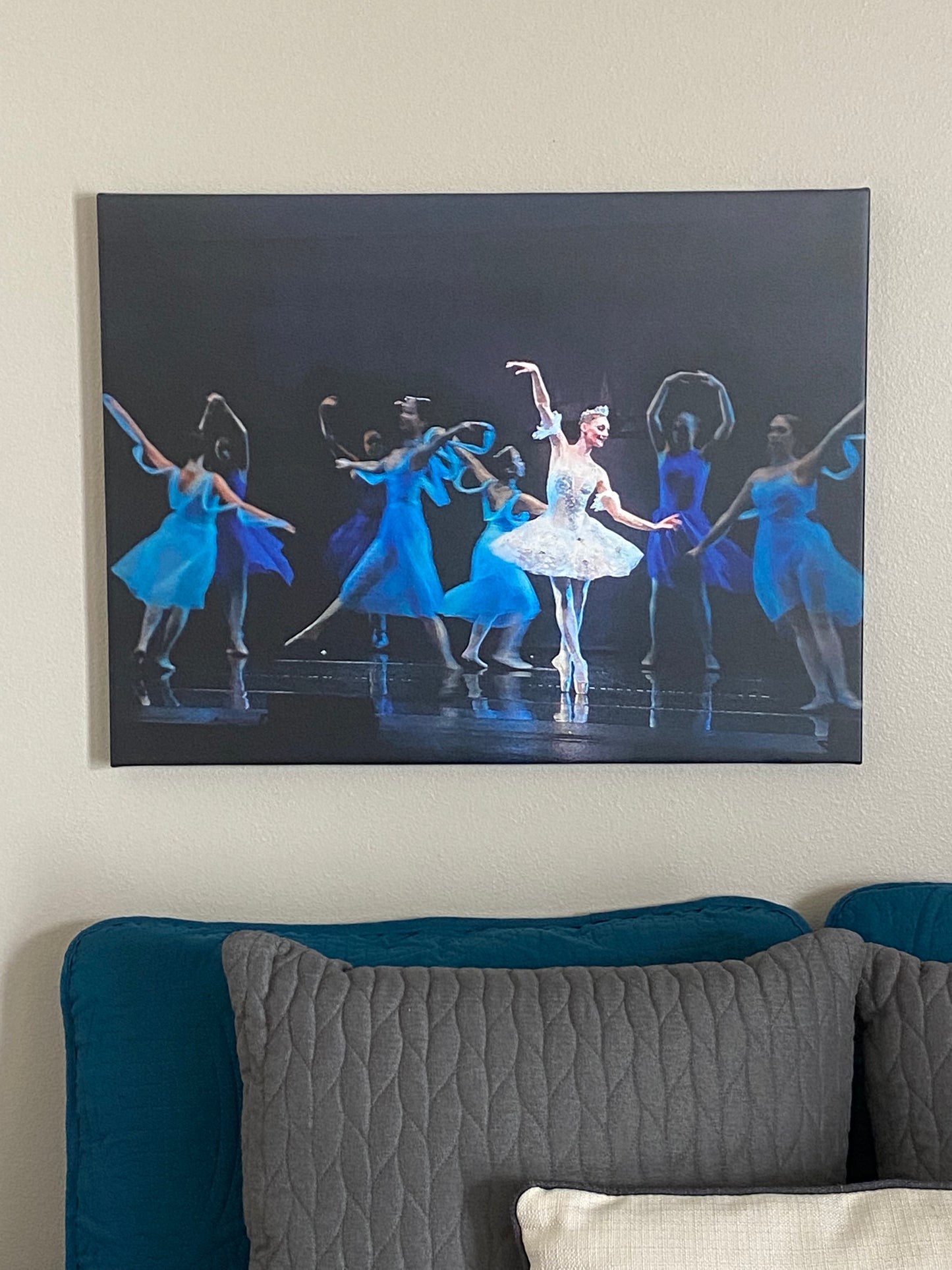 oil on canvas painting hanging on a wall in a home setting of ballerinas performing in white and blue costumes