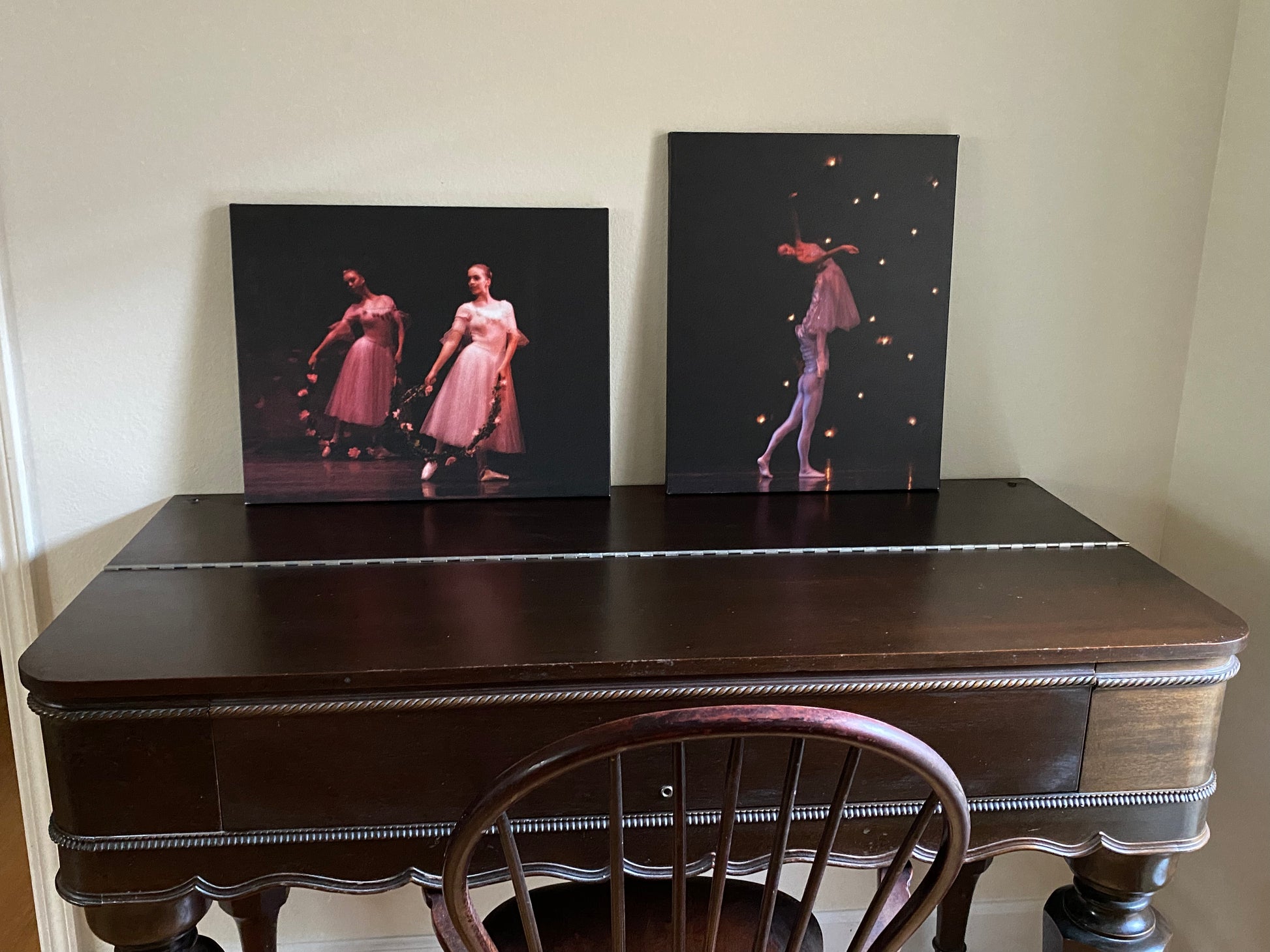 two oil paintings displayed in a home setting of Nutcracker ballet performances