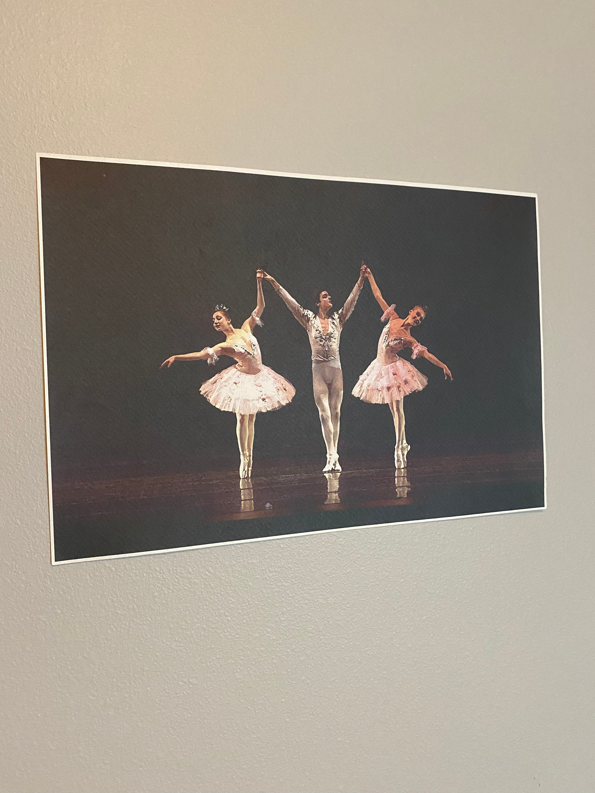 Ballet dancers performing on dark stage