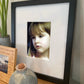 Artwork in a home setting of a beautiful child's face closeup