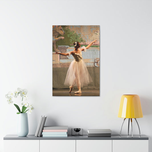 Canvas print of a painting of a single ballet dancer in white with muted pastel background hanging over a desk