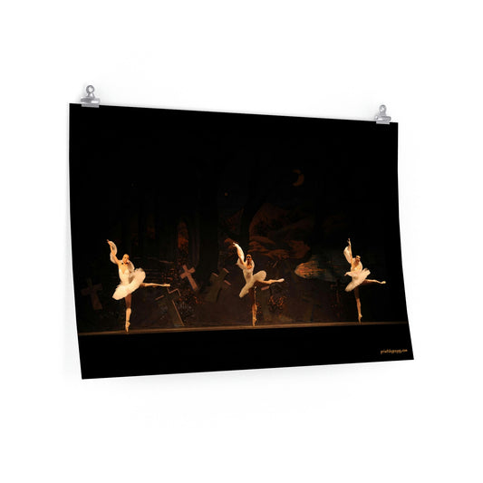 three ballerina's in tutus with a dark background