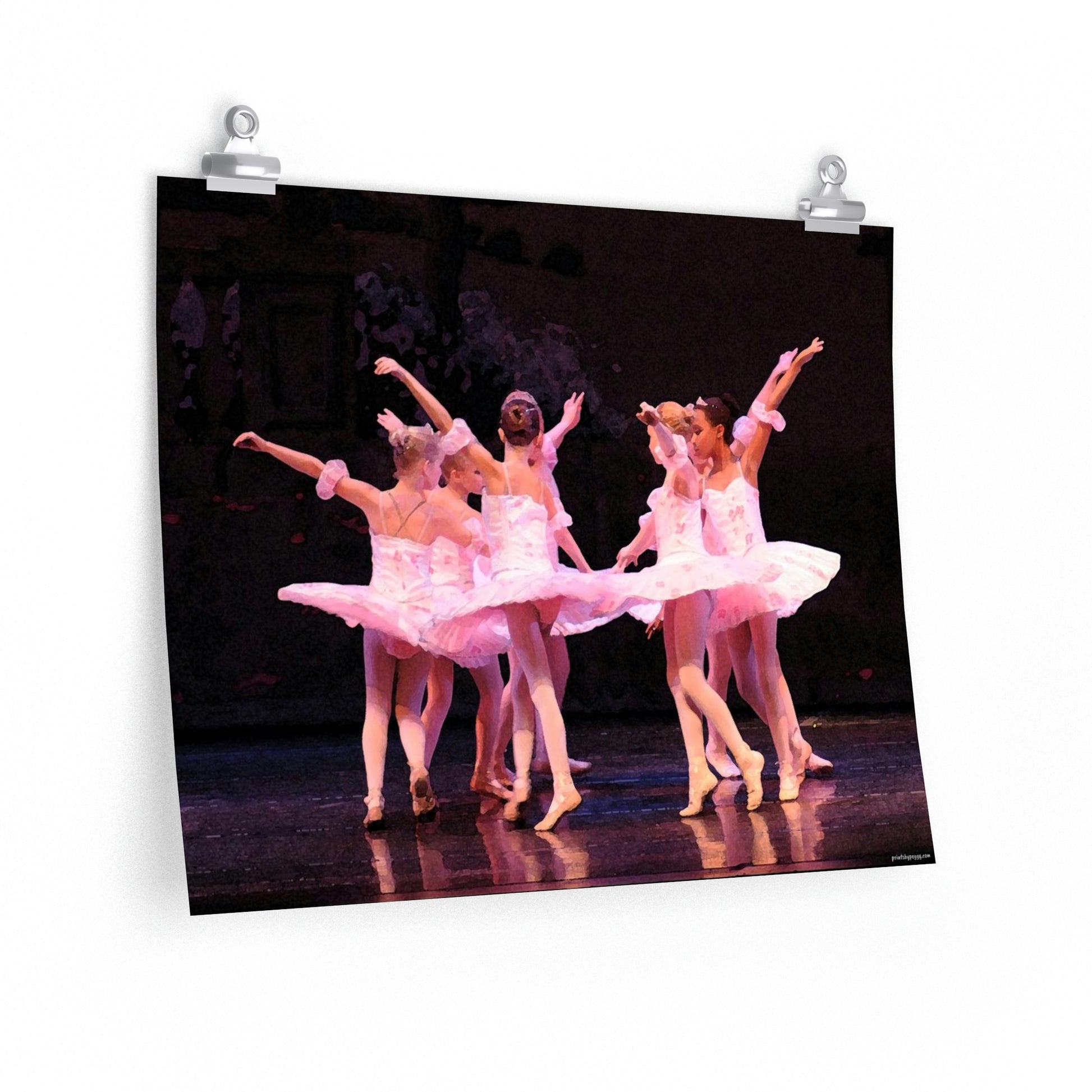 child dancers dressed in pink tutus on dark background on a premium matte poster