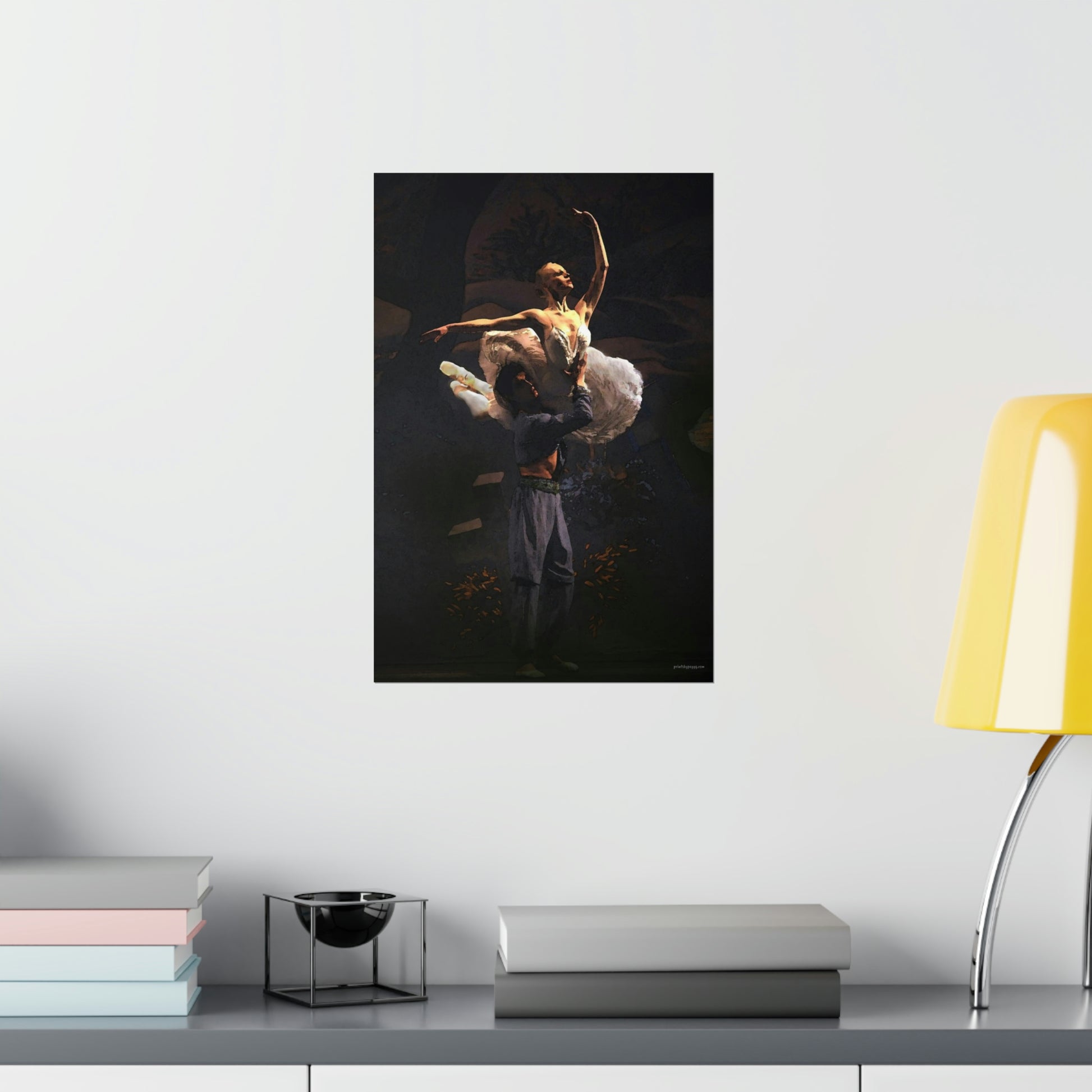 Prima Ballerina dressed in a white tutu being held in a dramatic aerial pose by a male dancer with a black background.