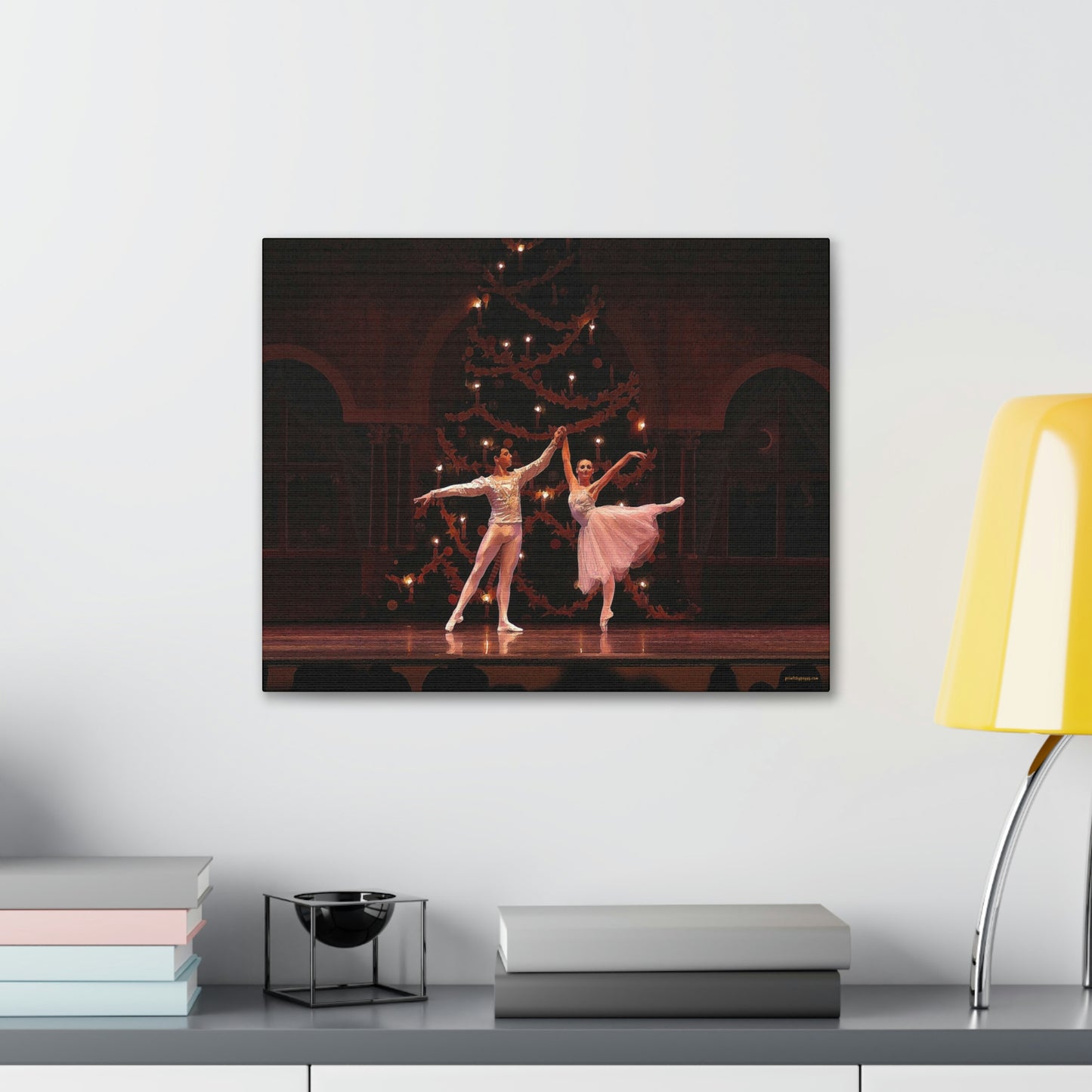 A Canvas Painting in a larger size hanging over a desk of a Ballet couple dancing in a Nutcracker performance on stage