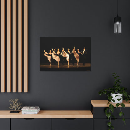 A painting hanging on a dark wall in a home setting of a  kick line comprised of 8 dancers. Females are in white and the males are in tuxedos with top hats with a black backdrop.