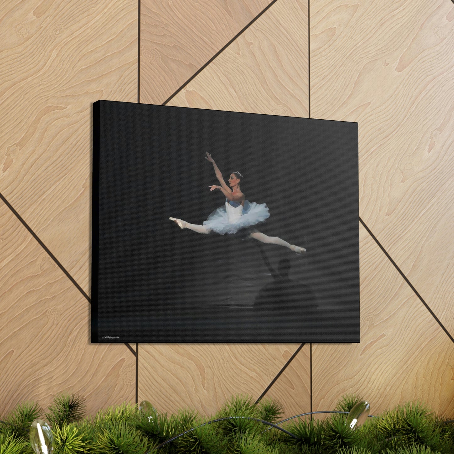 Ballerina in a white tutu in mid-air performing a leap. Background is black  