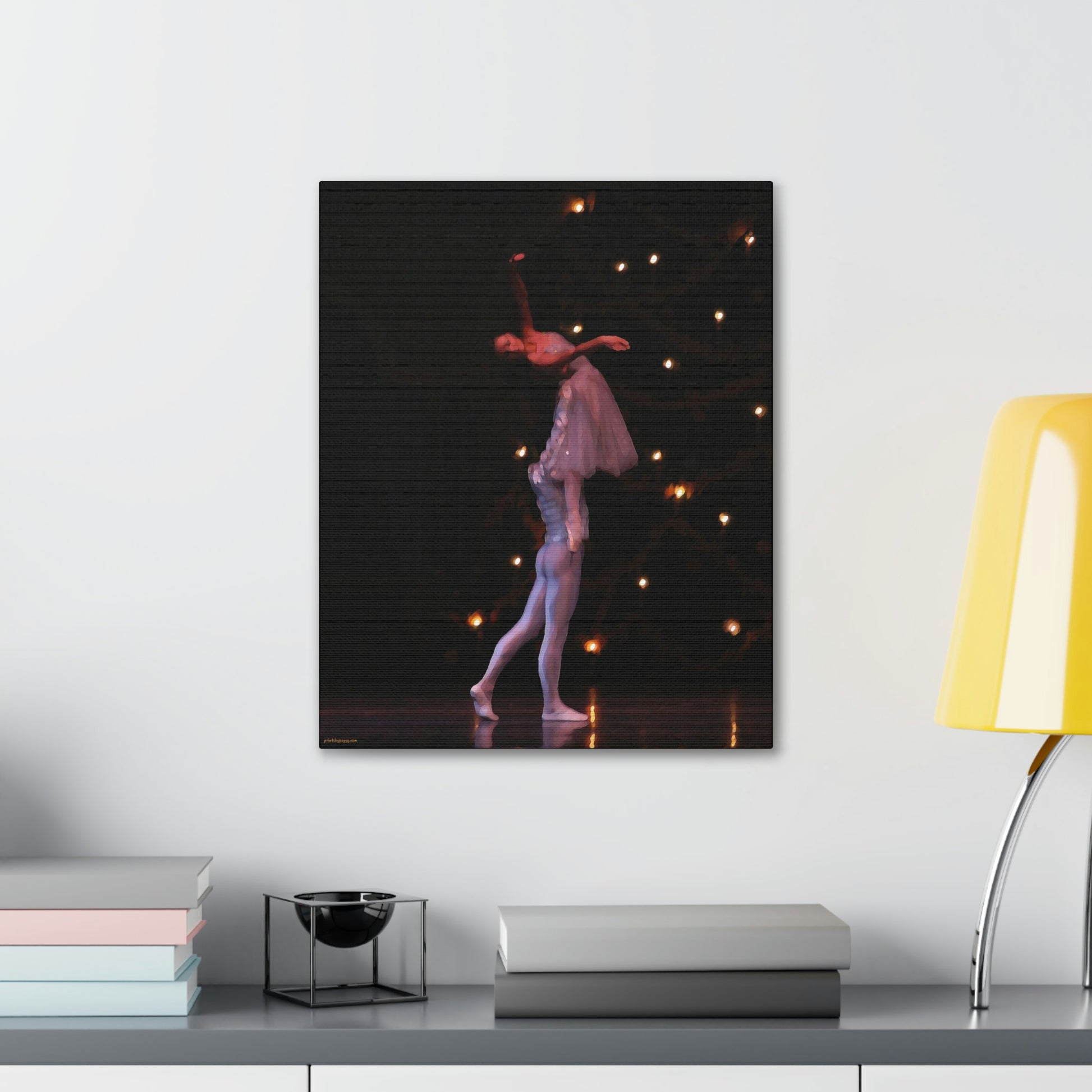 Canvas print on the wall over a desk of a Nutcracker performance with a male dancer lifting a female dancer. 