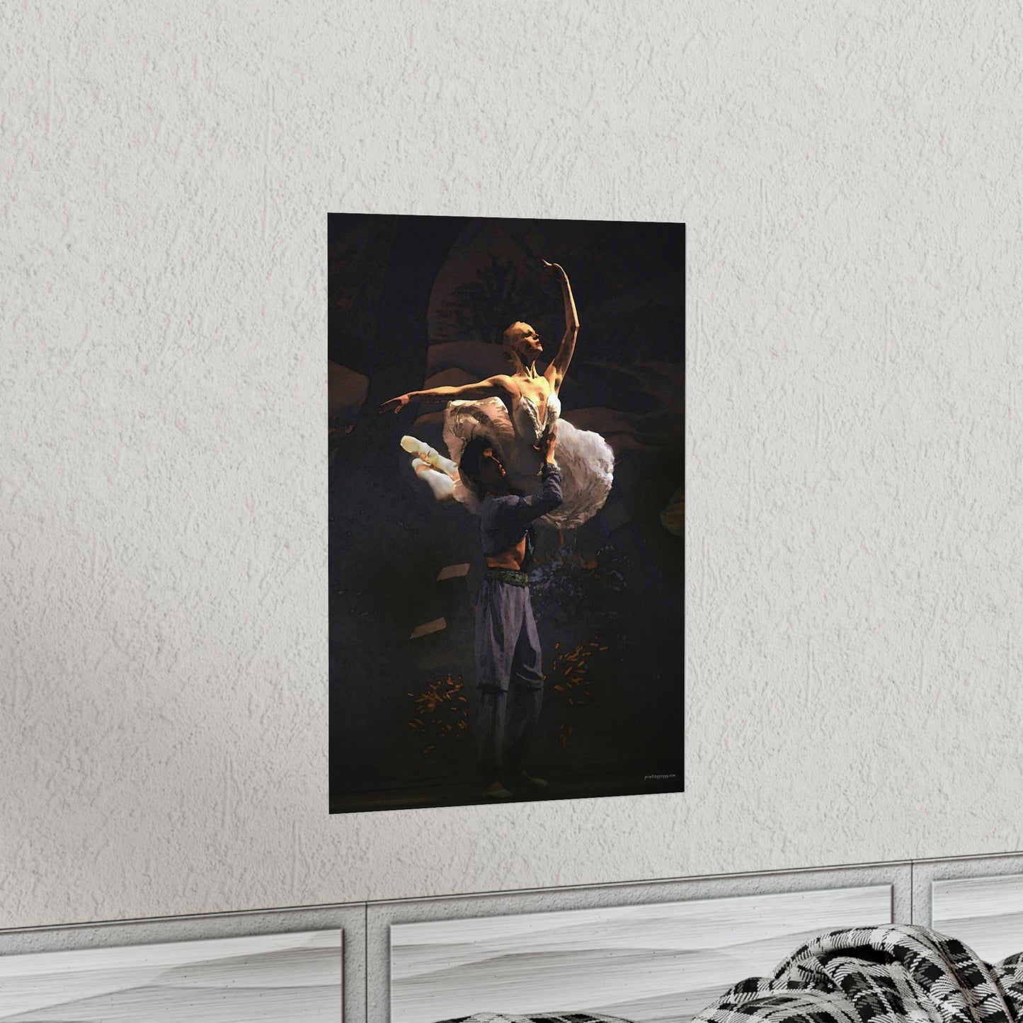 Prima Ballerina dressed in a white tutu being held in a dramatic aerial pose by a male dancer with a black background.