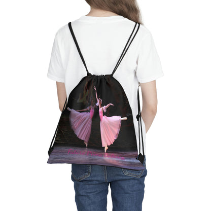 black drawstring bag with two ballet dancers in arabesque dressed in pink